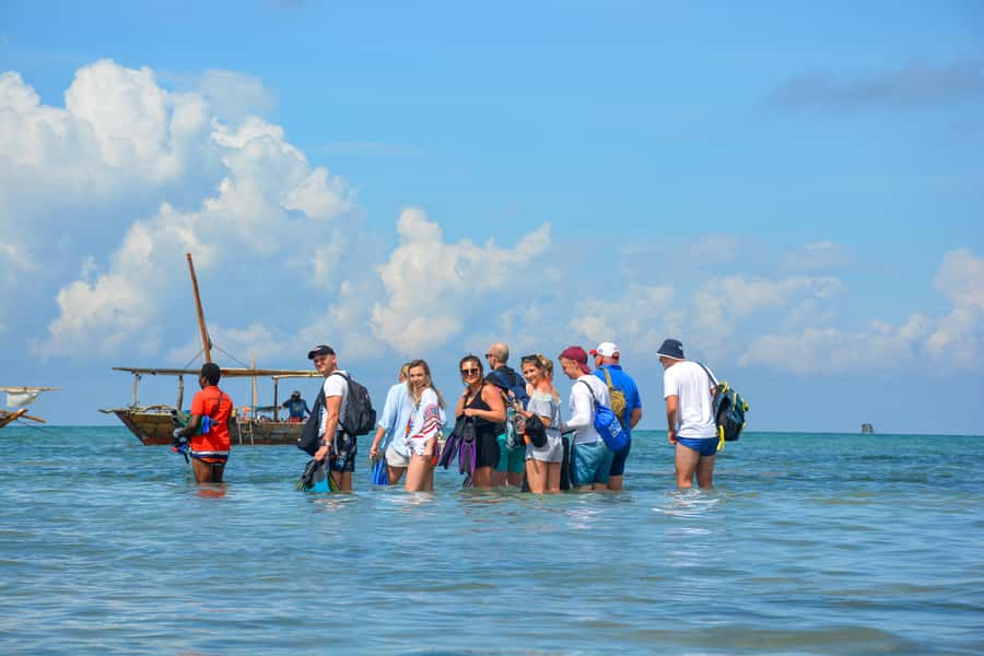 Matemwe: Mnemba Island Dolphin & Snorkeling Boat Trip - Snorkelling around Mnemba: corals, fish, and the reality of “best spots”