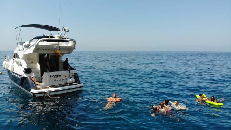 Mogan: Dolphin Watching Boat Trip with Swim Stop - KEEPER UNO and the small-boat advantage on deck
