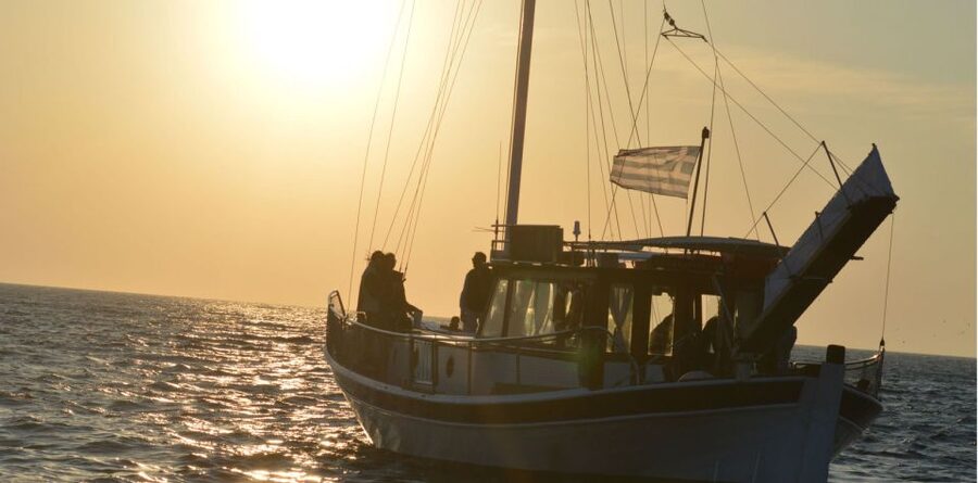 Mykonos: Sunset Boat Trip with Snacks and Drinks - The Traditional Wooden Boat and the Small-Group Feel