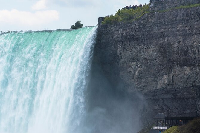 Niagara Falls Tour from Toronto: Boat Ride & Journey Behind Falls - Floral Clock, Niagara Parkway views, and quick photo hits