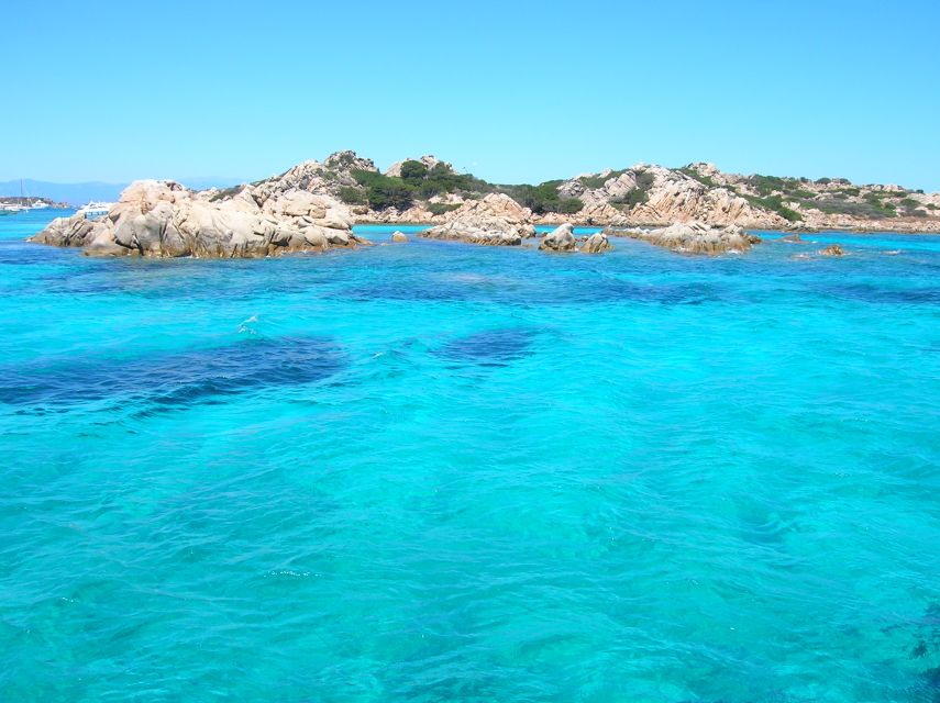 Olbia: Maddalena Archipelago Boat Tour with Minibus Transfer - Manto della Madonna and Budelli: shallow-water scenery and the pink-beach icon