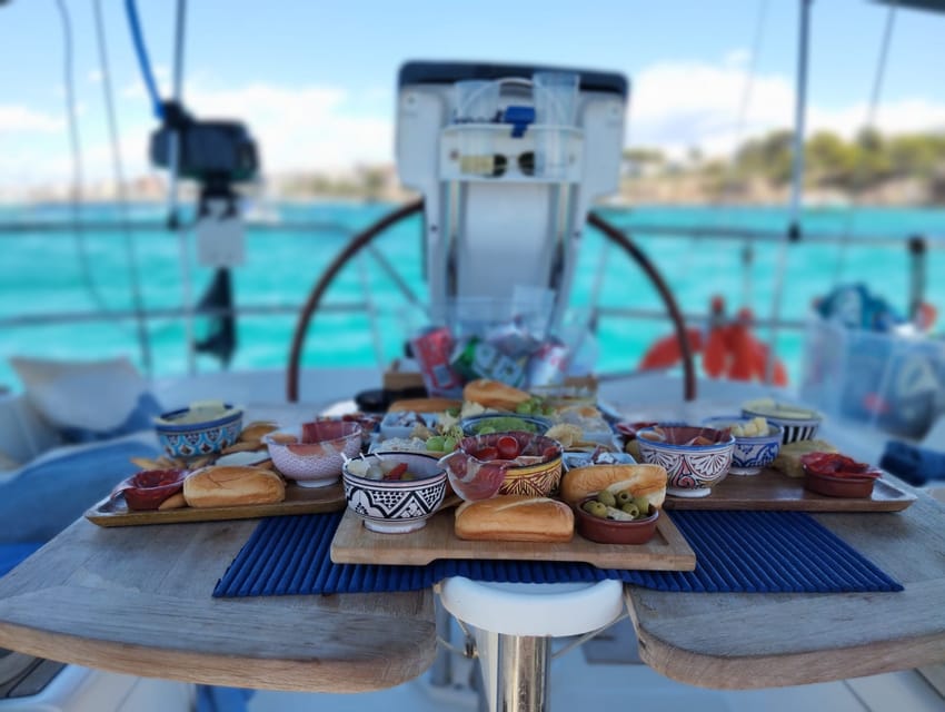 Palma Bay: Sailing Boat Trip W/ Water Toys Snacks & Drinks - Your captain and the small-group comfort factor
