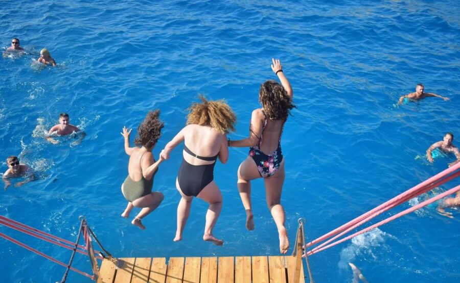 Palma de Mallorca: Palma Bay Boat Tour with Snorkeling - On-board vibe: DJ music, satellite sports, and live guitar moments