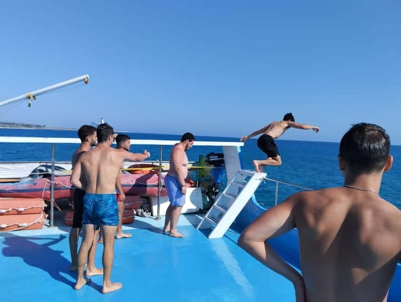 Paphos: Glass Bottom Boat Trip with Swimming or Snorkeling - Slide and jump time on the longer adventure cruise