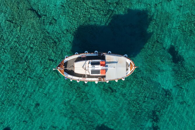 Paros Half Day Boat Tour from Naoussa port and Bay . - Stop 1: Langeri Beach for sandy swims and a quieter shoreline vibe