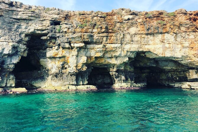 Polignano a Mare boat tour emotions, caves, diving and appetizers - The Dorino boating portion: history talk, music, and that fun cruise energy