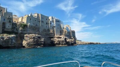 Polignano's coast and caves: a boat tour with drinks, swimming, music, and fun - Isola Blu Gita in Barca: the small-boat vibe and multilingual crew