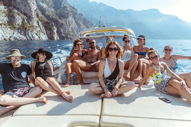 Positano & Amalfi Boat Tour from Naples with Light Lunch - Cruising stops: Roman ruins, a cliff waterfall moment, and Li Galli