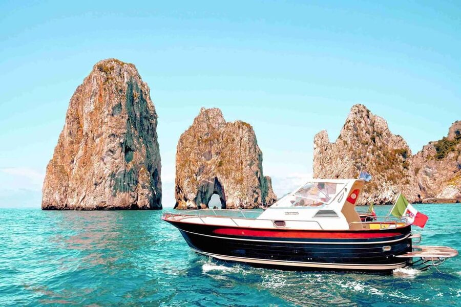 Positano: Capri and Blue Grotto Shared Boat Tour with Drinks - Cruising Capri by Sea: Faraglioni, Grottos, and Punta Carena Views