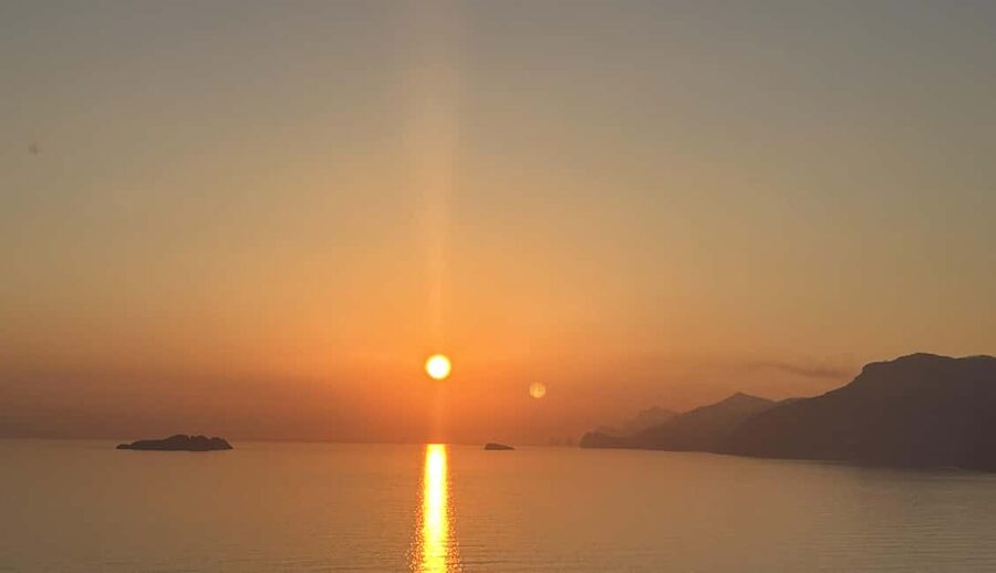 Positano: Sunset Group Boat Tour Amalfi Coast with Prosecco - Praiano pass-by: a scenic cruising stretch that sets up the later stops