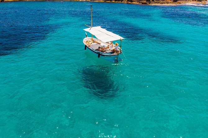Private 4-hour Mediterranean Boat Tour in Ibiza with Snorkeling - Stop 1: Cala Comte swim-and-snorkel time with a real sunset payoff