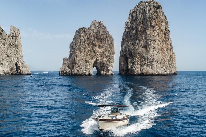 Private Boat Tour to Capri from Sorrento – Exclusive Experience - The white-walled cave, sea stacks, and Punta Carena Lighthouse views