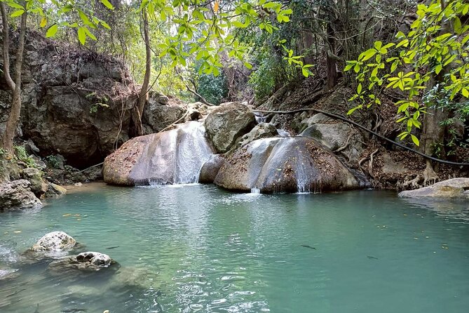 Private Tour to Erawan Waterfall and Boat Tour in Kanchanaburi - Lunch, water, and the included comforts that keep you going