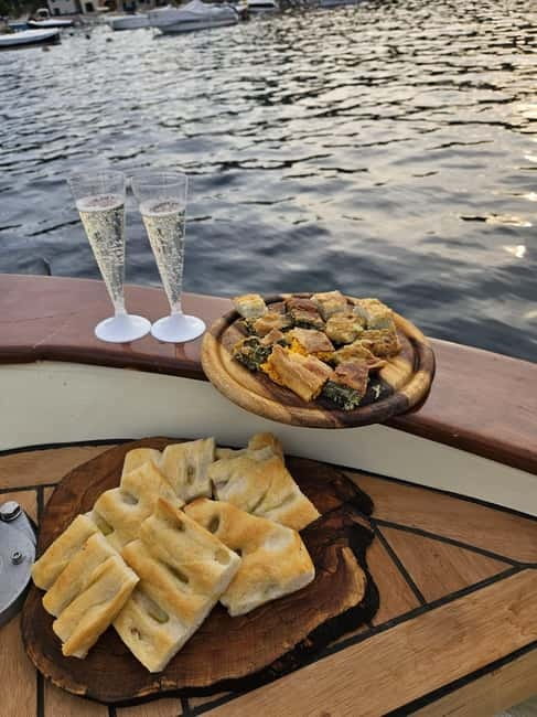 Rapallo: Sunset Boat Tour - Portofino in golden hour: aperitif, wine tasting, and sea-level photos