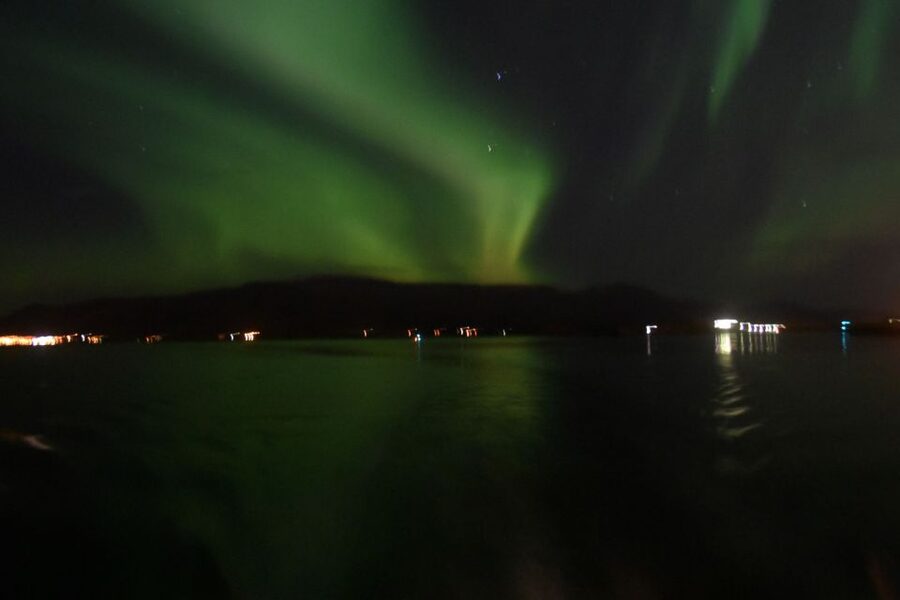 Reykjavik: Northern Lights Guided Boat Tour - What Happens On Board: Overalls, Heated Seating, and Free Photos