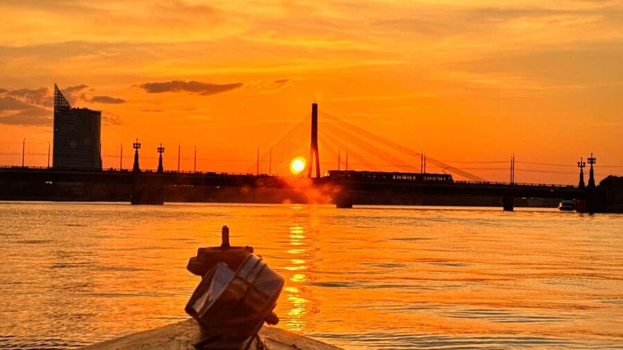 Riga: Canal Boat Tour with Welcome Drink & Audio Guide - Passing Riga’s Big Photo Targets: Central Market and the UNESCO Waterline