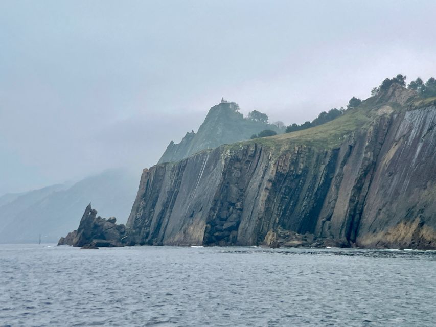 San Sebastian: 2 Bays Evening or Sunset Boat Tour with Cava - Drinks, audio, and the Polaroid: the small extras that boost value