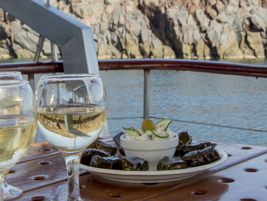 Santorini: Traditional Wooden Boat Tour with Meal and Wine - A traditional wooden boat cruise that actually prioritizes water time