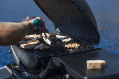 Santorini: Traditional Wooden Boat Tour with Meal and Wine - From hotel pickup in Thera to Vlychada boarding
