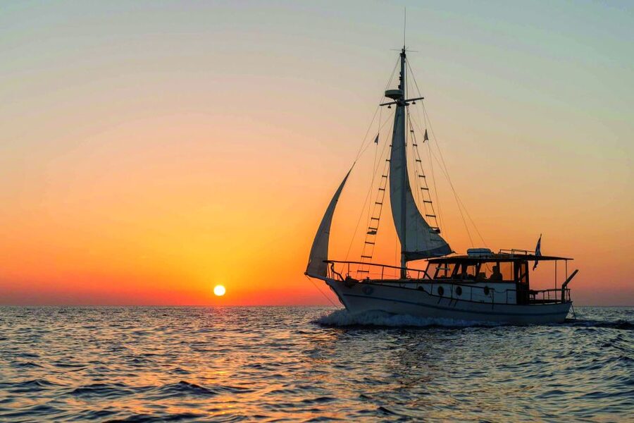 Santorini: Traditional Wooden Boat Tour with Meal and Wine - Thirassia Island snorkeling and the included Greek meal