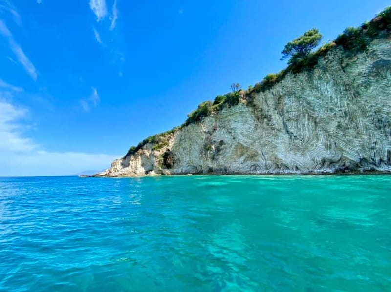 Sarandë: Ionian Coast Hidden Beaches and Caves Boat Tour - Plazhi i Ushtarit: A Quick Breather on the Way