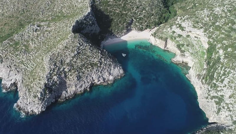 Secret Blue Cave & Grama Bay - Speed Boat Tour - Grama Bay: 2–3 Hours of Sand, Water, and Trails
