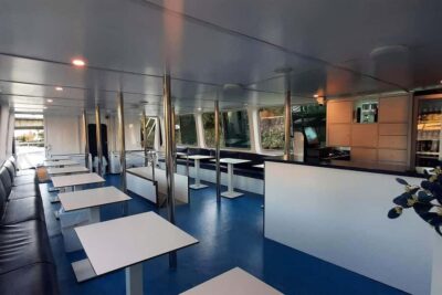 Seville: Restaurant Boat Ride on the Guadalquivir with Lunch/Dinner - Inside El Miarma Dos: Seating, Climate, and Practical Comfort