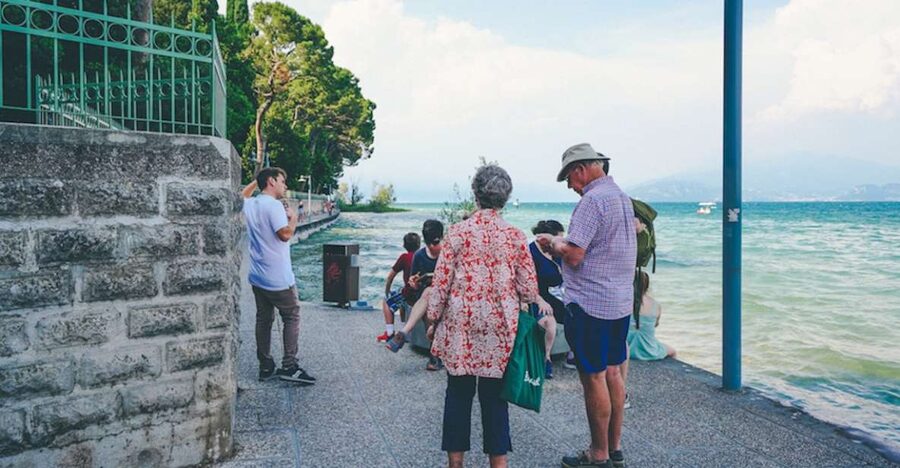 Sirmione: Village Highlights Walking & Lake Garda Boat Tour - Close-up castle walls and the drawbridge moment
