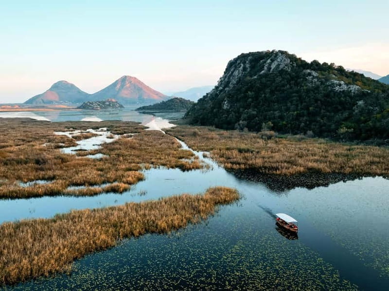 Skadar Lake: Guided Sunset Boat Tour with Wooden Boat & Wine - Wine, refreshments, and guided tales you can actually use