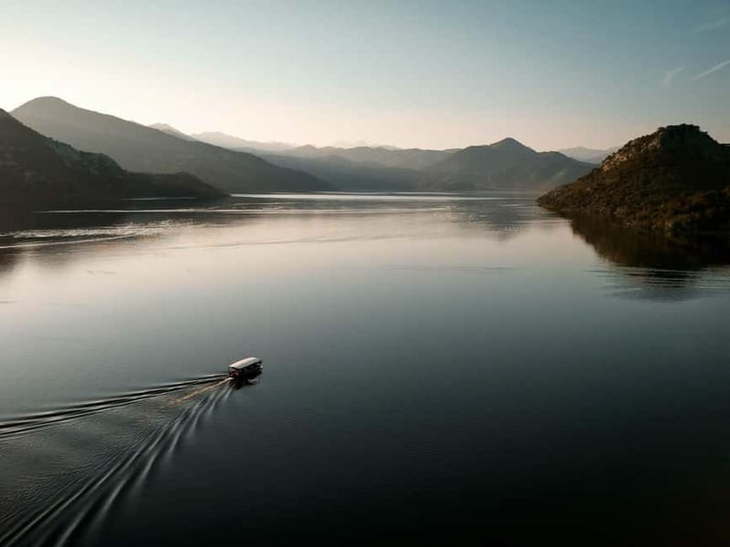 Skadar Lake: Guided Sunset Boat Tour with Wooden Boat & Wine - The swim stop: quick refresh, towel required