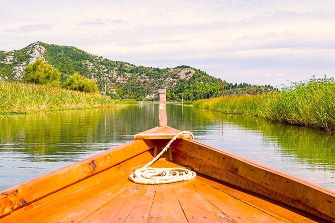 Skadar Lake National Park: Guided Boat Tour to Kom Monastery - Kamenik: wine, juice, and local snacks in the middle of wilderness