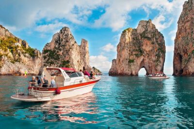 Small Group Boat Tour: Day Cruise from Sorrento to Capri - Capri coast from the sea: arches, grottos, and Faraglioni