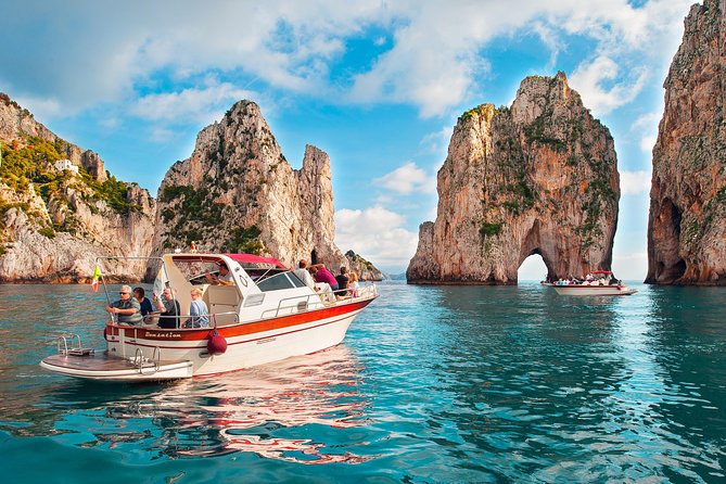 Small Group Boat Tour: Day Cruise from Sorrento to Capri - Capri coast from the sea: arches, grottos, and Faraglioni