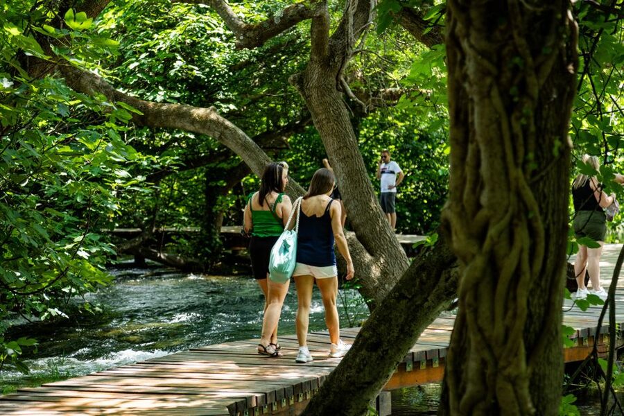 Split: Krka National Park Day Trip with Boat Ride & Swimming - Entering Krka: Trails, Waterfalls, and That Ethno Village Detour