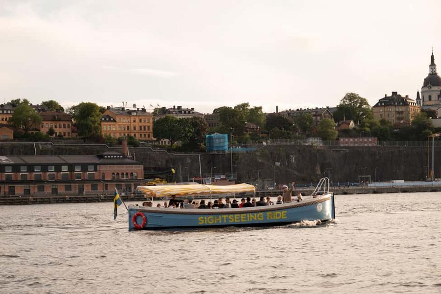 Stockholm: Guided City Sightseeing Open Electric Boat Tour - Vasa Museum from the water: one stop that changes your perspective