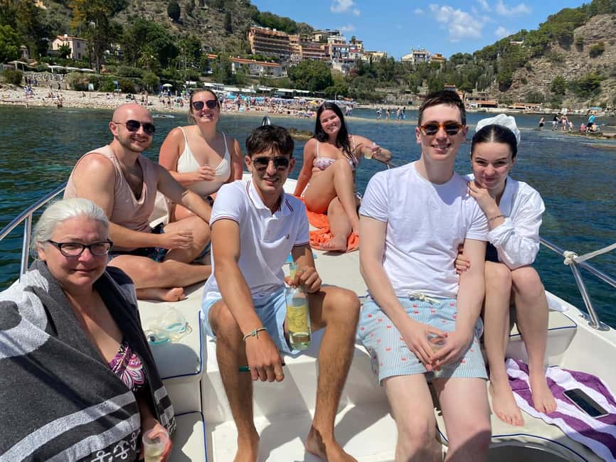 Taormina: Boat Tour with Sicilian Wine Tasting - Finding the boat at Spisone and getting out fast to the coves