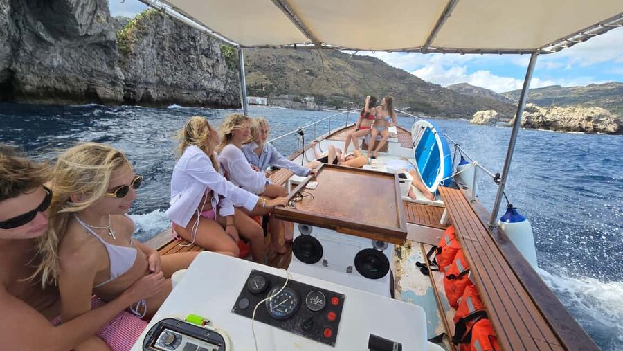 Taormina: Boat Tour with Sicilian Wine Tasting - Sicilian wine tasting, cold cuts, cheeses, and traditional plates