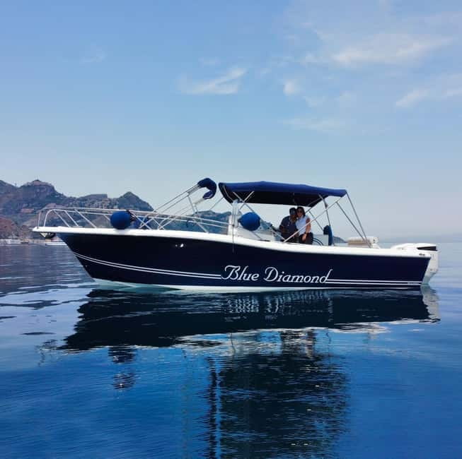 Taormina: Sunset Boat Tour with Dolphin Watching & Aperitif - On the Blue Diamond: cruising out of Giardini Naxos at golden hour