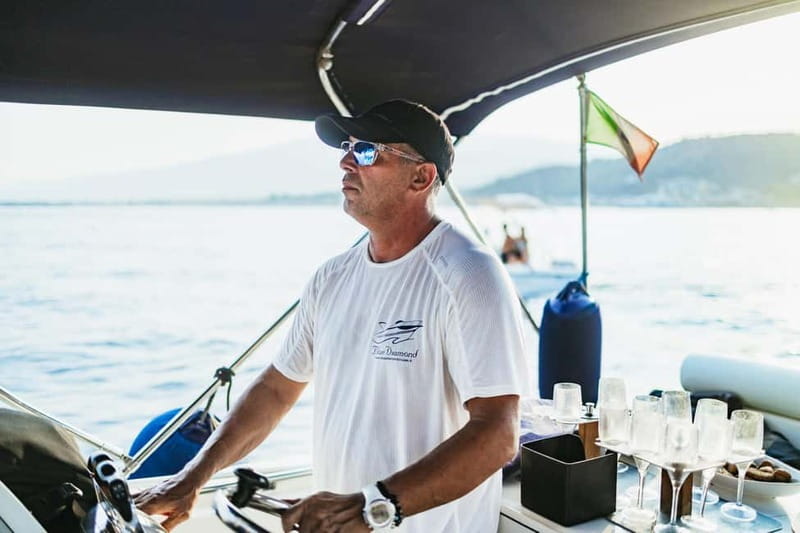 Taormina: Sunset Boat Tour with Dolphin Watching & Aperitif - The Isola Bella swim and snorkel stop in clear water