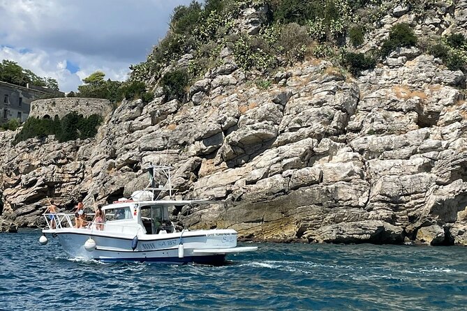 Tourist boat tour of the Gaeta peninsula - Spiaggia di Serapo on the West Side: One Beach View, a Clear Story
