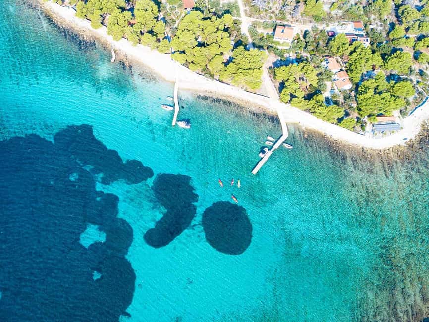 Trogir: Blue Lagoon, Maslinica, and Solinska Bay Boat Tour - Solinska Bay: Pine-Beach Time and the Fun Part (The Jump)