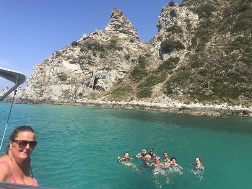 Tropea: Capo Vaticano Boat Trip with Snorkeling & Drink - Capo Vaticano lighthouse stop: photos on the rocks, then a swim
