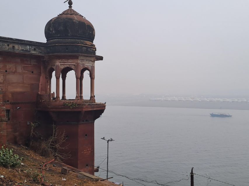 Varanasi: Sunrise Boat Tour with Arti Ceremony - Manikarnika Ghat: the venerated crematorium from the water