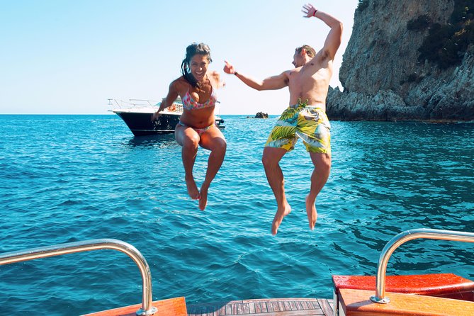 Very Small Group Capri Boat Excursion with Transfer from Positano - The boat cruise around Capri: caves, arches, and Faraglioni