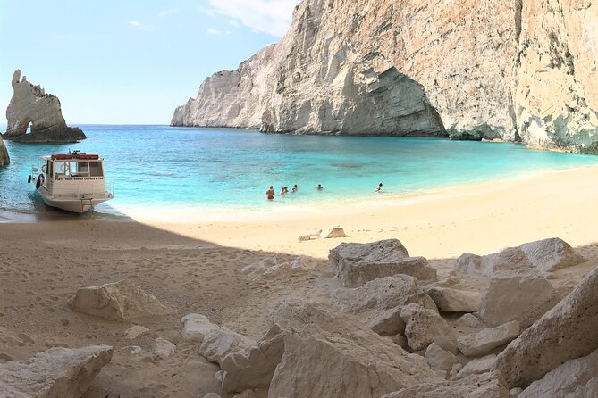 Zakynthos boat tour:Shipwreck& Local blue caves with 3 Swim Stops - Navagio Panagioti: the shipwreck beach stop (and how to use your 30 minutes)