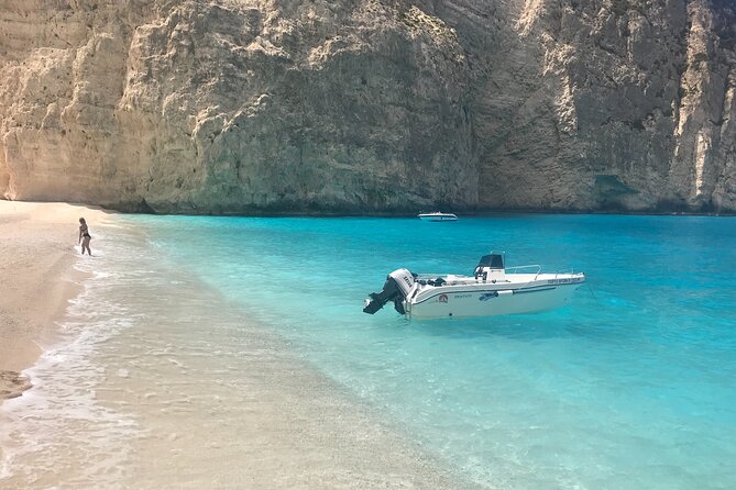 Zakynthos boat tour:Shipwreck& Local blue caves with 3 Swim Stops - Blue caves along the coast: tight passage moments you can actually see
